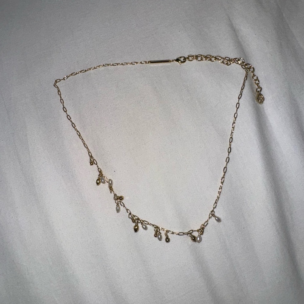 Elegant Gold Necklace with Dangle Charms